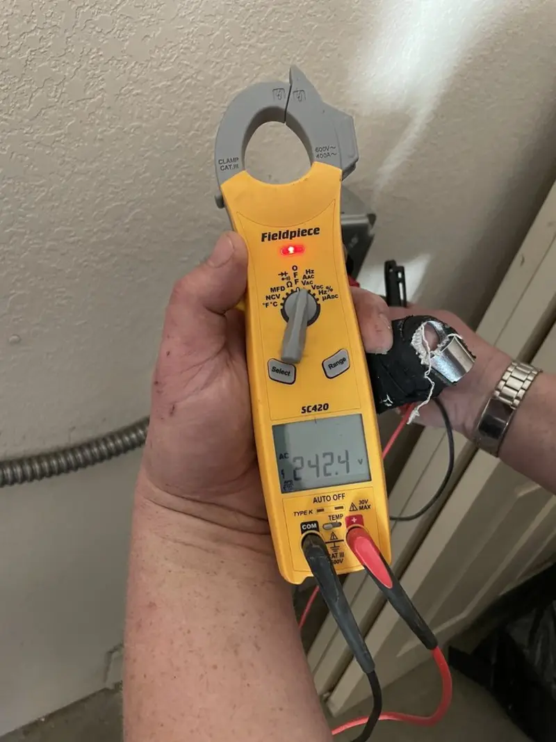Voltage testing with clamp meter during Electrical Installation Services in Cheshire